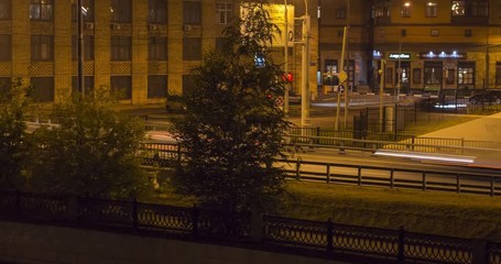 Wall Mural - embankment, boardwalk,  reflection in water , motion night scene  time lapse
