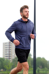 Determined jogger in workout routine