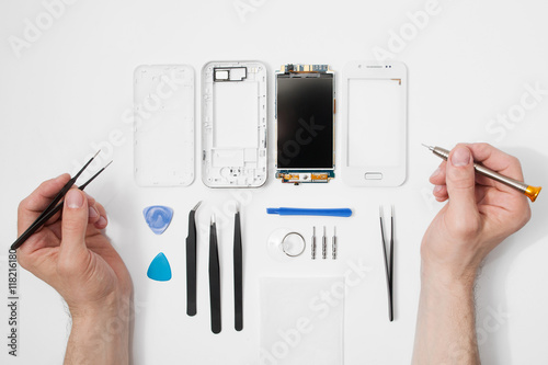Fotografía Repairman workplace with phone and special tools