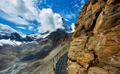 Wall Mural - Snow capped mountains. Matterhorn mount in the clouds. view of the north- eastern ridge . Trek near Matterhorn mount.