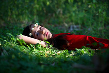 Girl Relaxing On Grass
