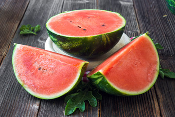 Wall Mural - Fresh sliced watermelon on wooden background