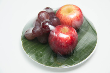  fruit in a plate on a white background