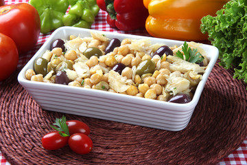 chickpea salad with cod, with some ingredients in the background