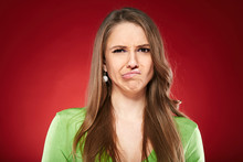 Disgusted Woman Over Red Background