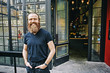 © Peathegee Inc/Blend Images - Caucasian man with beard smiling on sidewalk