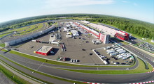 Trucks And Cars Parked On Stadium Moscow Raceway. Aerial View (Photo With Noise From Action Camera)