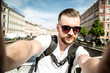 © semenovaole - Young guy with a beard and mustache in sunglasses and a white t-