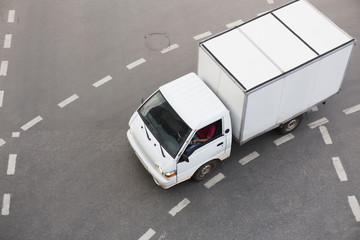 Poster - truck driving on city street