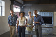 © Sam Diephuis/Blend Images - Business people smiling in office