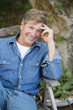 © Rick Gomez/Blend Images - Caucasian man sitting outdoors