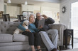 © John Fedele/Blend Images - Older couple video chatting with digital tablet