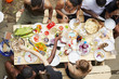 © Granger Wootz/Blend Images - High angle view of friends enjoying backyard barbecue