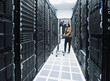 © Erik Isakson/Blend Images - Business people working in server room