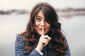 beautiful woman keeping a secret