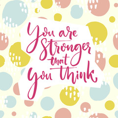 You are stronger that you think. Motivation quote lettering on playful green and pink hand drawn circles background