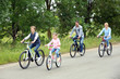 © Africa Studio - Happy family riding bikes on road