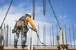© Don Mason/Blend Images - Caucasian worker holding chain at construction site