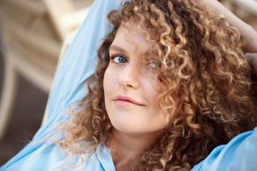 Young beautiful girl sitting in cafe.