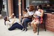 © Granger Wootz/Blend Images - Friends taking cell phone pictures together on city street