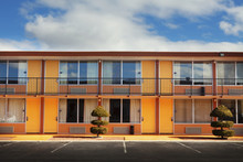 Parking lot, doors and windows of motel