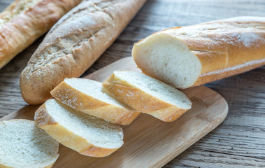 Poster - Three baguettes on the wooden background