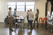 © Sam Diephuis/Blend Images - Business people talking in office