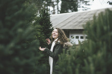 Caucasian Woman Walking In Christmas Tree Lot