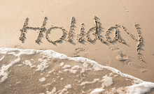 "Holiday" Written In Sand Beach