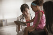 © John Fedele/Blend Images - Doctor showing girl digital tablet