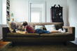 © Inti St Clair/Blend Images - Caucasian boy using digital tablet on sofa