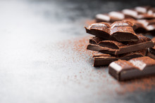 Dark Chocolate On A Dark Background, Closeup With Place For Text, Selective Focus