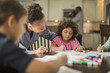 © John Fedele/Blend Images - Mother and children drawing in kitchen