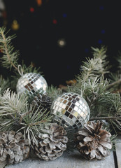 Christmas balls with fir branches and glasses of champagne