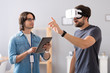 © zinkevych - Pleasant colleagues testing virtual reality glasses