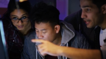 Wall Mural -  Team of young computer hackers trying to gain access to a computer system