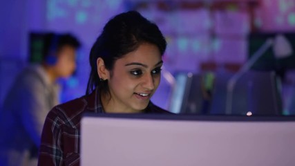 Wall Mural -  Young computer hacker trying to gain access to a computer system