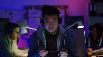 Wall Mural -  Portrait of young male gamer in front of computer
