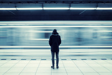 Lonely Man Shot From Behind At Subway Station With Blurry Moving Train 