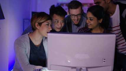 Wall Mural -  Team of young computer hackers trying to gain access to a computer system