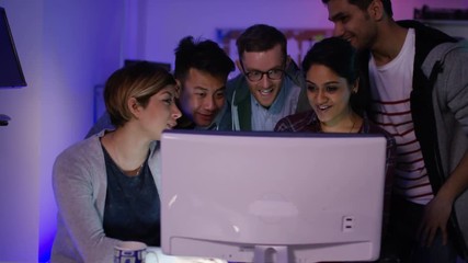 Wall Mural -  Team of young computer hackers trying to gain access to a computer system