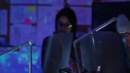 Wall Mural -  Team of young computer hackers trying to gain access to a computer system