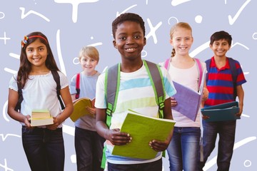 Canvas Print - Composite image of smiling little school kids in school corridor