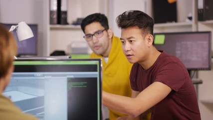 Wall Mural -  Young computer experts working in office with lots of computers