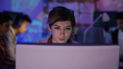 Wall Mural -  Young computer hacker trying to gain access to a computer system