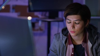 Wall Mural -  Young computer hacker trying to gain access to a computer system