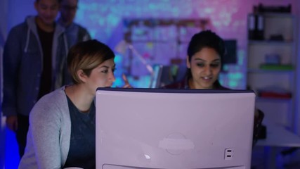 Wall Mural -  Team of young computer hackers trying to gain access to a computer system