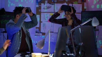 Wall Mural -  Young computer programmers trying out virtual reality viewers