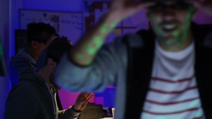 Wall Mural -  Young computer programmers trying out virtual reality viewers