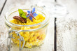 Delicious couscous with nuts and curry on wooden background